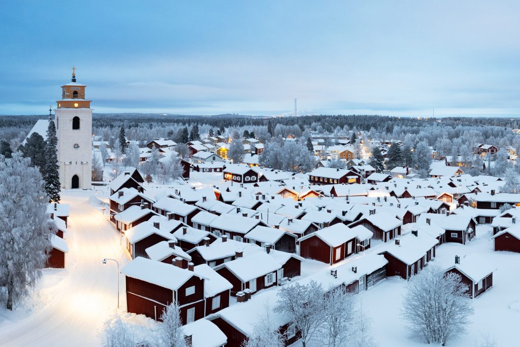 View of the medieval village of Gammelstad with traditional wooden cottages and the bell tower covered with snow and ice, Lulea, Sweden, UNESCO World Heritage site, Lapland, Scandinavia, Europe