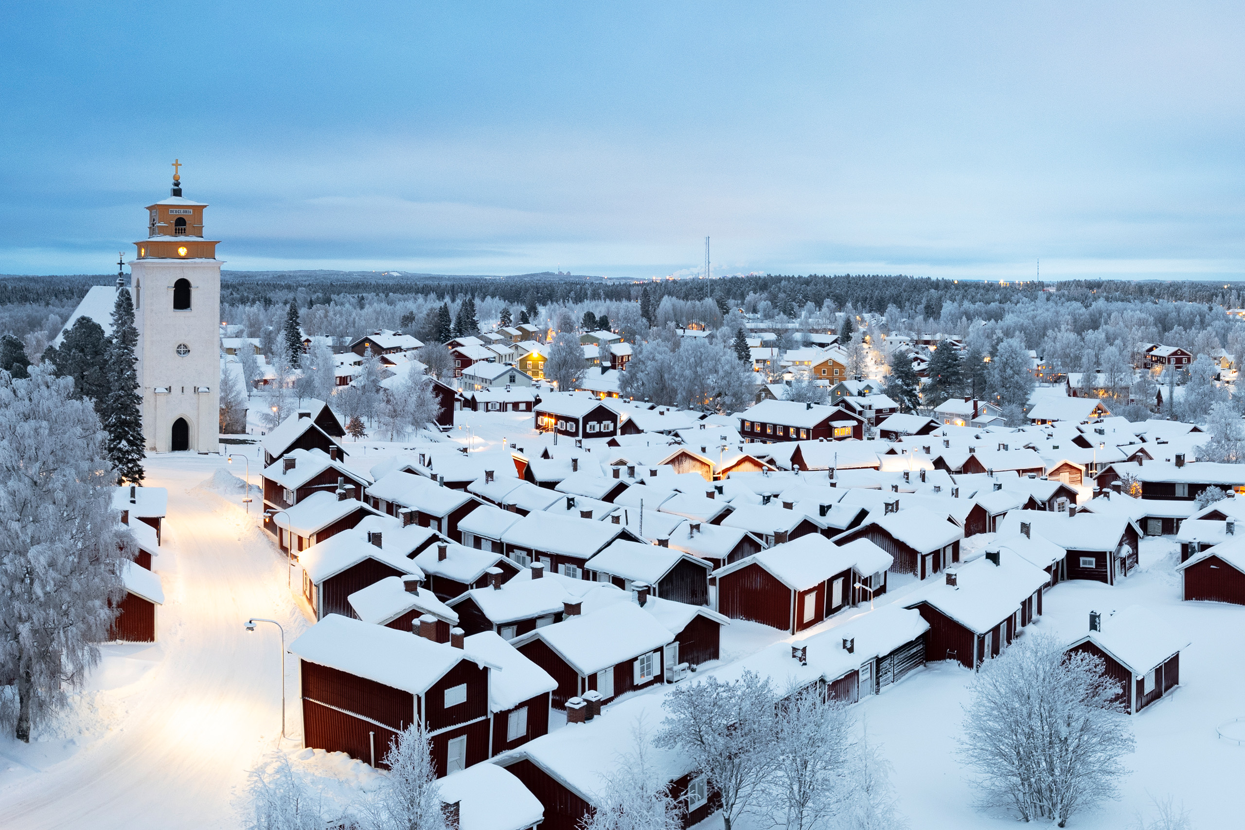 View of the medieval village of Gammelstad with traditional wooden cottages and the bell tower covered with snow and ice, Lulea, Sweden, UNESCO World Heritage site, Lapland, Scandinavia, Europe